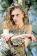 beautiful girl in green wood by summer
