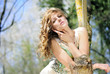 beautiful girl in green wood by summer