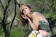 beautiful girl in green wood by summer