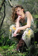 beautiful girl in green wood by summer