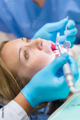 Photo: Close-up of dental treatment on female patient Close-up of dental treatment on female patient