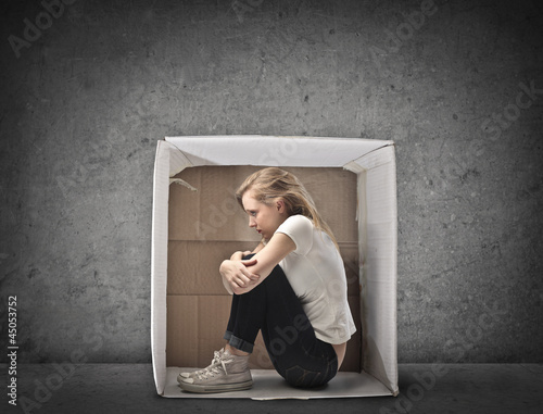 Photo: Blonde Girl Crouched in a Box Blonde Girl Crouched in a Box