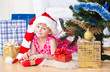 Photo: girl with gifts near a New Year tree girl with gifts near a New Year tree
