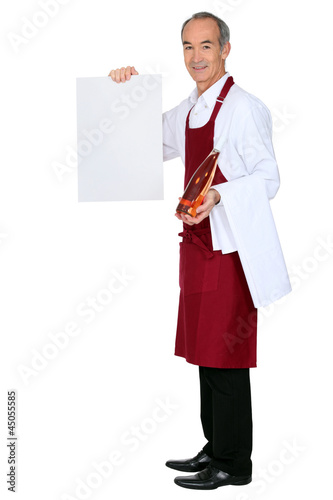 Photo: Male waiter hold message board Male waiter hold message board