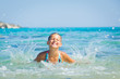 Young girl playing in the sea