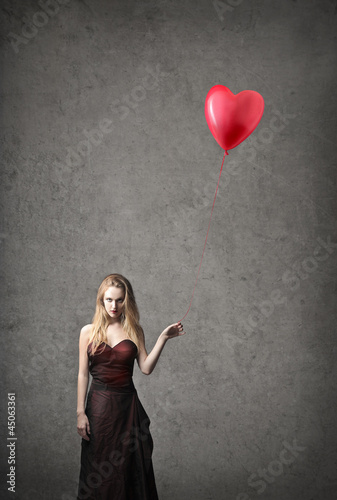 Photo: Holding a Balloon Holding a Balloon