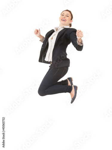 Photo: jumping happy businesswoman in dark jacket, full length jumping happy businesswoman in dark jacket, full length