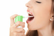 suffering from pain, young woman using throat spray