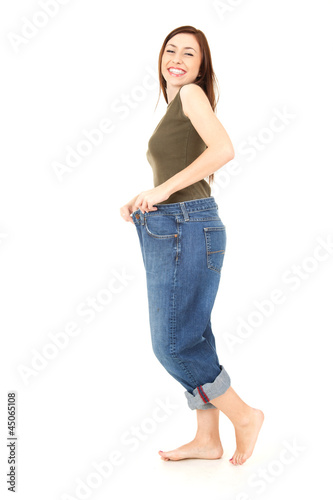 Photo: young woman delighted with her dieting result young woman delighted with her dieting result
