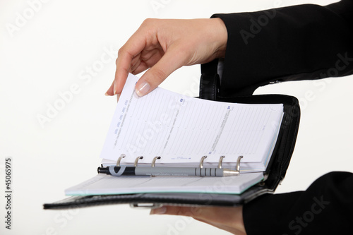 Photo: secretary holding an agenda secretary holding an agenda