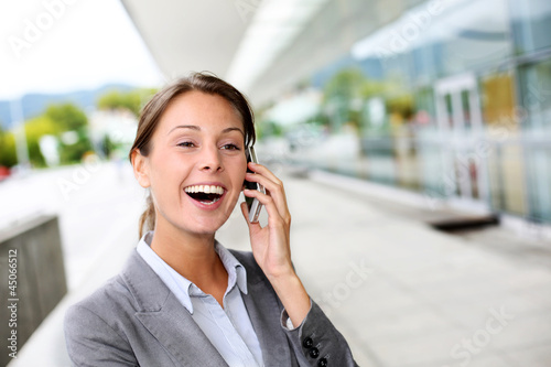 Photo: Cheerful businesswoman smiling on the phone Cheerful businesswoman smiling on the phone