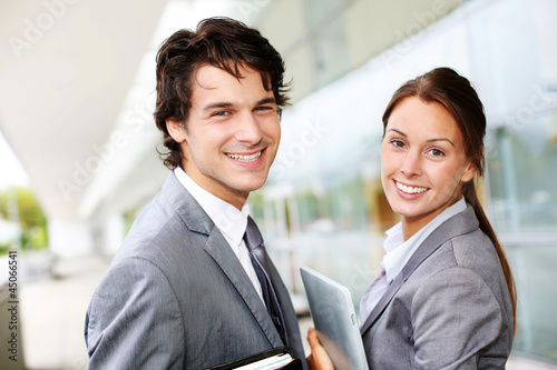 Photo: Successful business team standing outside Successful business team standing outside