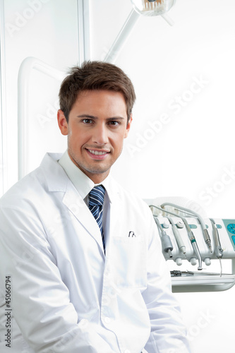 Photo: Male Dentist Smiling Male Dentist Smiling