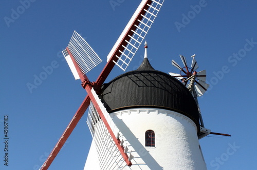 Photo: Windmill against a blue sky on the Danish island Bornholm Windmill against a blue sky on the Danish island Bornholm