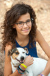 Young attractive girl with her dog.
