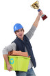 Builder stood with award for recycling
