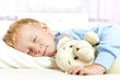 Photo: Small child sleeping in bed Small child sleeping in bed