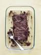 "Chocolate cake with fork in tray, directly above"