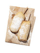"Freshly fried donuts with powdered sugar on brown paper bag, studio shot"