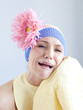 "Young woman dressed as a baby, studio shot"