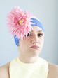 "Young woman dressed as a baby, studio shot"