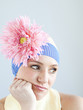 Photo: "Young woman dressed as a baby, studio shot" "Young woman dressed as a baby, studio shot"