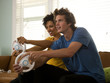 "USA, Utah, Provo, young couple playing video games in living room"