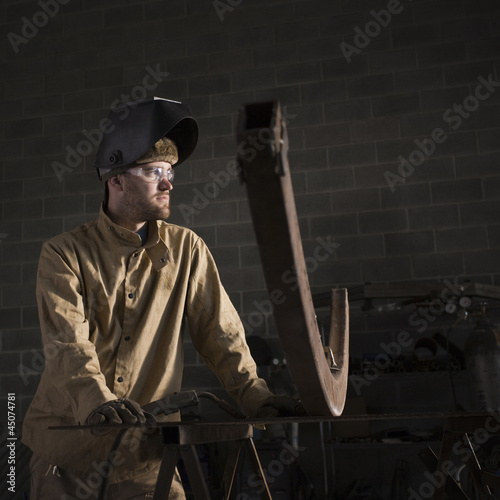 Photo: "USA, Utah, Orem, male welder in workshop" "USA, Utah, Orem, male welder in workshop"