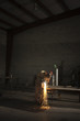 "USA, Utah, Orem, man welding metal in workshop"