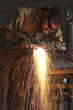 "USA, Utah, Orem, man welding metal in workshop"