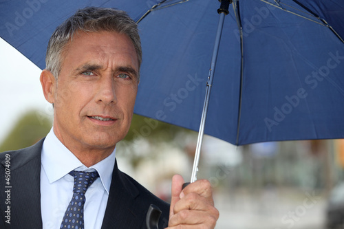 Photo: Businessman with an umbrella Businessman with an umbrella