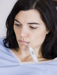 "Orem, Utah, USA, young woman with thermometer in mouth"