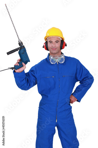 Photo: Confident hand man with power drill Confident hand man with power drill