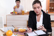 Couple eating breakfast separately