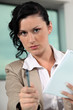 businesswoman giving her pen