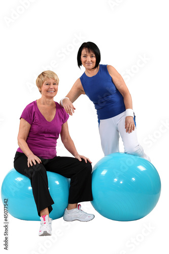 Photo: A couple of middle aged women working out. A couple of middle aged women working out.