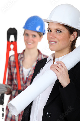 Photo: a female architect and a female builder a female architect and a female builder