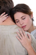 Young passionate couple hugging