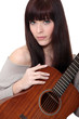 Woman playing the acoustic guitar