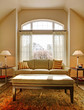 Living room with large window and classic sofa