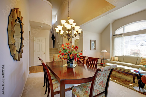 Photo: Classic elegant dning room with living room and large window. Classic elegant dning room with living room and large window.
