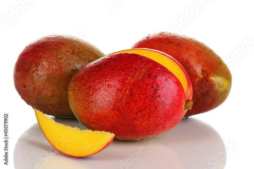 Photo: Ripe appetizing mango isolated on white Ripe appetizing mango isolated on white