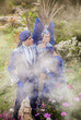 Photo: Couple in expensive dark blue costume of illusionist pose Couple in expensive dark blue costume of illusionist pose