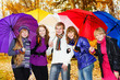 Friends with umbrellas