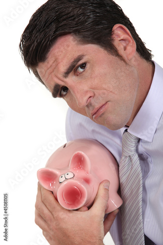 Photo: Businessman with piggy bank Businessman with piggy bank