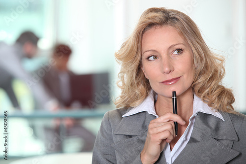 Photo: thoughtful blond woman thoughtful blond woman