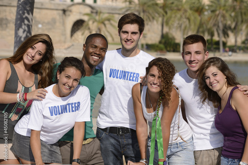Photo: happy and diverse volunteer group happy and diverse volunteer group