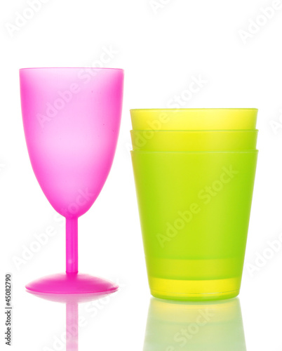 Photo: Bright plastic tableware isolated on white Bright plastic tableware isolated on white