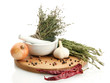 dried herbs in mortar and vegetables, isolatrd on white