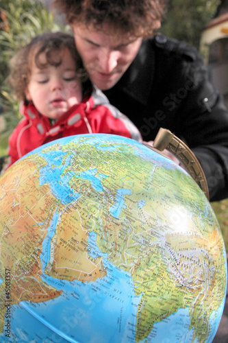 Photo: Father and son with a globe Father and son with a globe